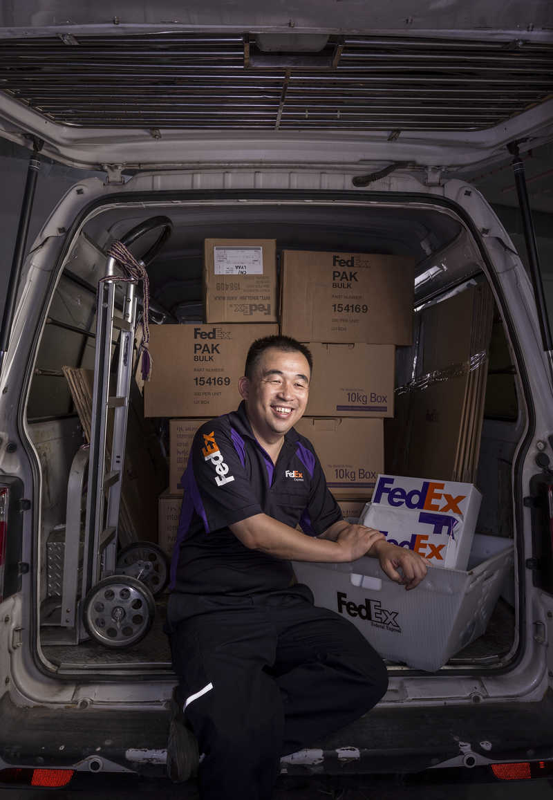 Qing Hua, a FedEX worker in Shenzhen, China.